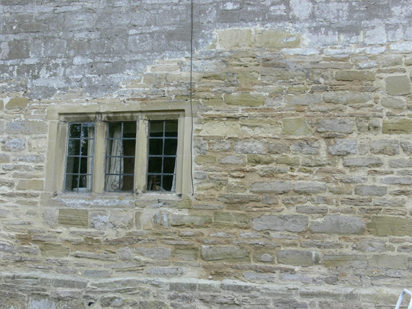 Masonry repairs to stone wall