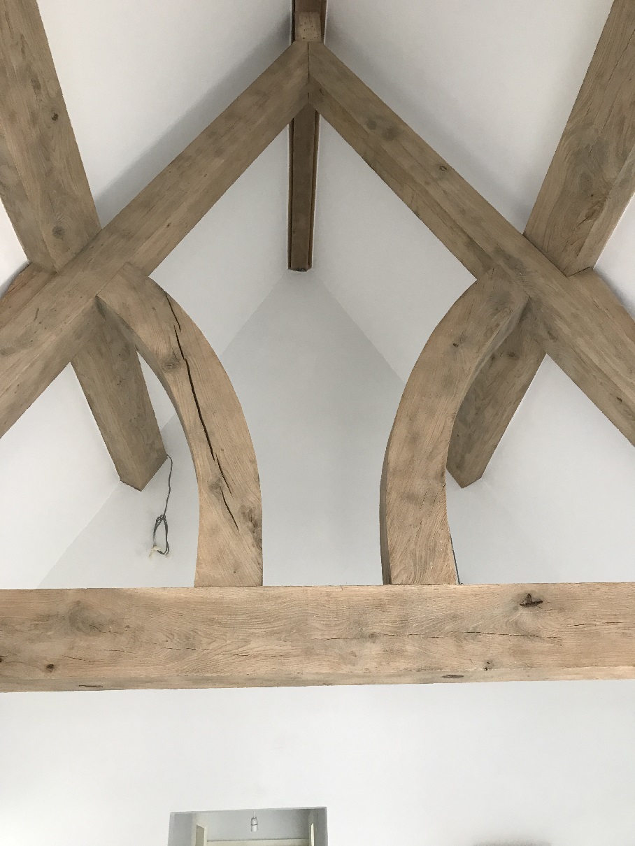 Lime plastered ceiling with oak truss
